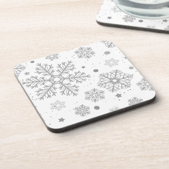 Silver snowflakes on white coaster (Left Side)