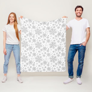 Silver snowflakes on white fleece blanket
