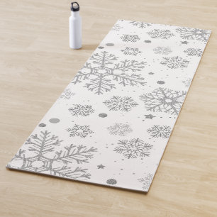 Silver snowflakes on white yoga mat
