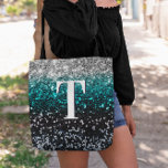 Silver Teal Black Gradient Chunky Glitter Monogram Tote Bag<br><div class="desc">A modern bold single letter double layer text monogram in white with a black drop shadow. The font size, colour and style are customizable. The background is a faux chunky glitter in a silver, teal and black ombre with sparkly and bokeh blur spots. Move or delete the faux sparkle graphic...</div>