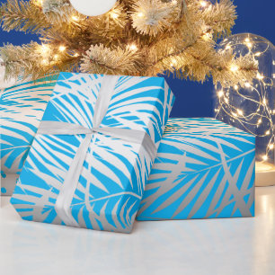 Silver tropical leaf jungle pattern on blue wrapping paper