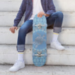 "Silver Turtle Radiance" | Coastal  Skateboard<br><div class="desc">This coastal artwork features a silver sea turtle in the centre of a geometric mandala on a blue background.</div>