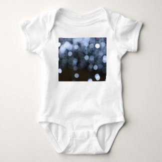 Silver, white bokeh night background. baby bodysuit