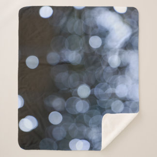 Silver, white bokeh night background. sherpa blanket