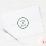 Simple and elegant names dark green wedding classic round sticker<br><div class="desc">Simple and elegant names dark green and white wedding Classic Round Sticker. It displays your names on white with a green border. It coordinates with our "Green tropical leaves" wedding collection.</div>