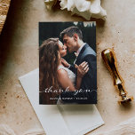 Simple and Stylish | Modern Two Photo Wedding Thank You Card<br><div class="desc">This elegant wedding thank you card is modern and minimalist,  yet also has a charming vintage vibe. Chic white calligraphy script decorates the front,  along with your favourite wedding photo,  and an additional photo goes onto the back with your own personal message to your guests.</div>