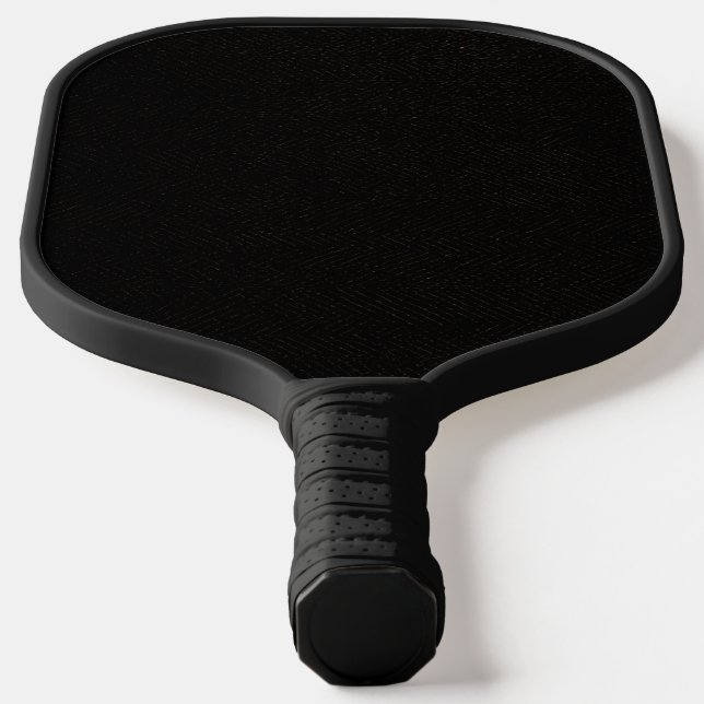 Simple black background with a slight pattern pickleball paddle (Laydown)