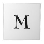 Simple black monogram on white tile<br><div class="desc">Simple,  elegant WHITE ceramic tile with optional,  customizable monogram. Designed to coordinate with music notes version. Delete monogram for plain tile. Available in other colours and with matching items.</div>