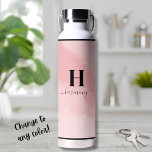 Simple Blush Pink Monogram Water Bottle<br><div class="desc">This chic water bottle features a blush pink background with a personalized initial and script calligraphy name elegantly displayed below. The soft, feminine design exudes a girly and modern vibe, making it a perfect accessory for her. Whether you're heading to the gym, yoga, the office, or just out and about,...</div>