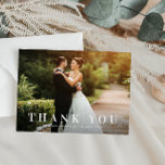 simple bold text wedding thank you card<br><div class="desc">an elegant yet simple white text design with a bold text look and a lovely image of the bride and groom,  the text and colours can be personalized.</div>