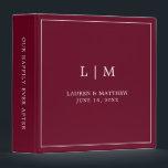 Simple Burgundy Monogram Elegant Wedding Binder<br><div class="desc">Simple wedding binder featuring a modern yet elegant design with your two letter monogram along with your names and wedding date surrounded by a thin border. All text is in white over a burgundy background. The fonts and background colours may be changed to any colours you wish. A chic and...</div>