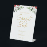 Simple Classic Christmas Wedding Guest Book Sign<br><div class="desc">This simple classic Christmas wedding guest book sign features a clean, bright white backdrop with simple, minimalist black and gold lettering and handwritten calligraphy accents. Embellishments of beautiful and classic green and red Christmas wreaths with delicate gold features create a perfect winter holiday aesthetic while maintaining a polished elegance for...</div>