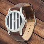 Simple Elegant Classic White Black Stripes Leather Watch<br><div class="desc">Women's Watches. Ladies Sporty Watch. Beautiful Simple Elegant Classic Vertical White and Black Stripes Leather Straps Silver Watch Dial Face. Very fast shipping Worldwide. Own this Elegant Chic Sporty Watch with Black and White Stripe dial NOW! Great addition to any wardrobe. Makes a great Gift idea! 30 Day Money Back...</div>
