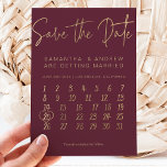 Simple gold burgundy calendar save the date announcement postcard<br><div class="desc">Click the customize button to move around the heart on your wedding date.. Send your save the date card with this elegant faux gold typography  with gold heart on a red burgundy minimalist background.</div>