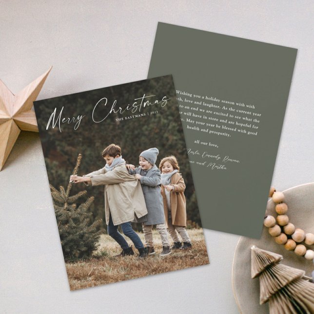 Simple Handwritten Script Photo Christmas Holiday Card (A simple photo christmas holiday card with handwritten Merry Christmas script typographic overlay.)
