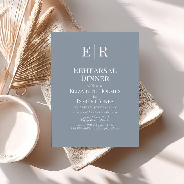 Simple Invitation de Dîner de Répétition Monogramm (Simple Dusty Blue Monogram Rehearsal Dinner Invitation on a table with neutral boho decor.)
