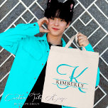 Simple Light Blue Split Monogram Gift Tote Bag<br><div class="desc">Steeped in elegance and simplistic charm, this Light Blue Split Monogram Tote Bag is the quintessential gift that spells class and functionality. The soothing light blue hue channels a calm and serene vibe while the split monogram design adds a personal touch, making it a unique possession or a thoughtful gift....</div>