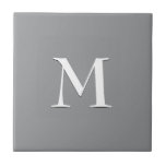 Simple Modern Grey White Monogram Tile<br><div class="desc">Simple,  elegant SILVER GRAY ceramic tile with optional,  customizable monogram. Designed to coordinate with music notes version. Delete monogram for plain tile. Available in other colours and with matching items. Ideal for bathroom decor or kitchen decor updates.</div>