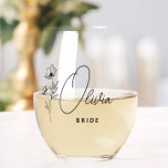 Simple Modern Personalized Bride Floral Stemless Wine Glass<br><div class="desc">Looking for a chic, trendy, yet simple gift for the bride? These wildflower floral modern script stemless wine glasses are a practical gift that she can use even after her wedding day! All text, including title and script names, can be changed. You can change the title to fit the whole...</div>