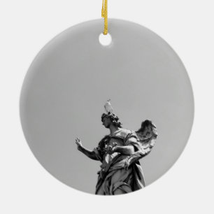 Simple, modern photo of seagull on top of statue ceramic ornament