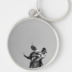 Simple, modern photo of seagull on top of statue keychain
