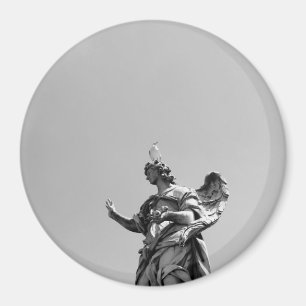 Simple, modern photo of seagull on top of statue magnet