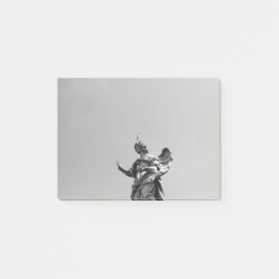Simple, modern photo of seagull on top of statue post-it notes