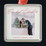 Simple Modern Script Our First Christmas Wedding Metal Ornament<br><div class="desc">A beautiful keepsake to celebrate your first Christmas as a married couple. This design features your favourite wedding photo in a simple white frame with the headline "Our first Christmas" in red modern script font. Personalize with your names and years in red. Makes a great gift.</div>