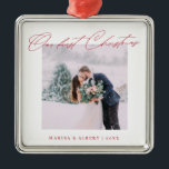 Simple Modern Script Our First Christmas Wedding Metal Ornament<br><div class="desc">A beautiful keepsake to celebrate your first Christmas as a married couple. This design features your favourite wedding photo in a simple white frame with the headline "Our first Christmas" in red modern script font. Personalize with your names and years in red. Makes a great gift.</div>
