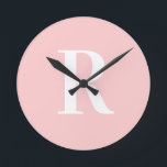 Simple Monogram Modern Blush Pink Round Clock<br><div class="desc">This is a simple, modern, personalized monogram design. This stylish design is in trending blush pink with stylish typography. It's perfect for a personalized gift or ideal as a new home decor accessory for yourself. Simply add your initial letter by typing it into the personalize this text box. Check out...</div>