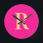 Simple Monogram Modern Hot Pink Round Clock<br><div class="desc">This is a simple, modern, personalized monogram design. This stylish design is in trending hot pink with stylish typography. It's perfect for a personalized gift or ideal as a new home decor accessory for yourself. Simply add your initial letter by typing it into the personalize this text box. Check out...</div>