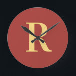 Simple Monogram Modern Round Clock<br><div class="desc">This is a simple, modern, personalized monogram design. This stylish design is in trending brown with stylish typography. It's perfect for a personalized gift or ideal as a new home decor accessory for yourself. Simply add your initial letter by typing it into the personalize this text box. Check out the...</div>