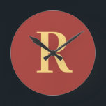 Simple Monogram Modern Round Clock<br><div class="desc">This is a simple, modern, personalized monogram design. This stylish design is in trending brown with stylish typography. It's perfect for a personalized gift or ideal as a new home decor accessory for yourself. Simply add your initial letter by typing it into the personalize this text box. Check out the...</div>