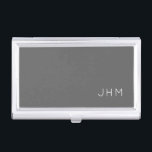 Simple Professional Grey Classic Monogram Business Card Holder<br><div class="desc">Professional business card holder features sleek simple minimalist design in a grey colour palette with white accents. Custom monogram initials presented on a simple grey background; positioned lower right hand corner. Shown with personalized monogram initials in a simple classic modern font, this executive business card holder is designed as a...</div>