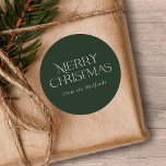 Simple Stylish Merry Christmas | Name | Green Classic Round Sticker<br><div class="desc">These stylish Christmas stickers feature simple,  stylish typography reading,  "Merry Christmas" in ivory. A text template is included for easy personalization. The background colour (dark green) can be customized to any colour you'd like. Great for envelope seals,  gift tag stickers,  party favour stickers,  and more!</div>