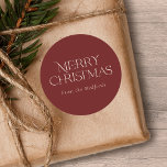 Simple Stylish Merry Christmas | Name | Red Classic Round Sticker<br><div class="desc">These stylish Christmas stickers feature simple,  stylish typography reading,  "Merry Christmas" in ivory. A text template is included for easy personalization. The background colour (burgundy red) can be customized to any colour you'd like. Great for envelope seals,  gift tag stickers,  party favour stickers,  and more!</div>