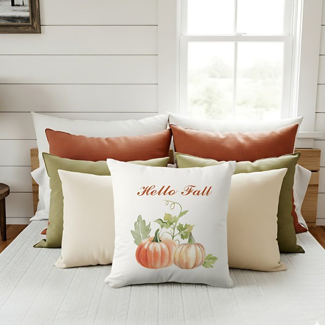 Simple Watercolor Modern Fall Accent Throw Pillow (“Hello Fall” pillow with watercolor pumpkins decorates a bright autumn-inspired sofa.)
