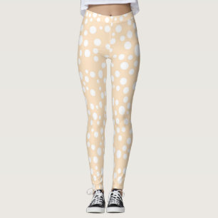 Simple white dotted pattern on peach background leggings