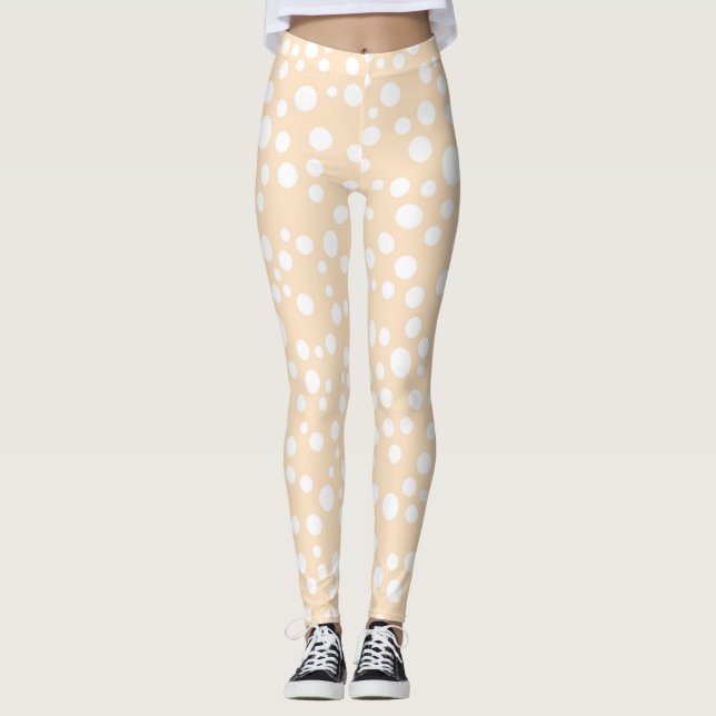 Simple white dotted pattern on peach background leggings (Front)