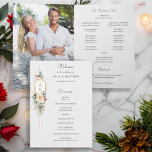 Simply Elegant Christmas Floral Monogram Program<br><div class="desc">This lovely winter botanical program features bouquets of ivory roses and flowers,  red holly berries,  fir and golden snowflakes surrounding an elegant gold label for your monogram on a pale pearl grey background. Includes editable text fields for your ceremony and wedding party participants.</div>