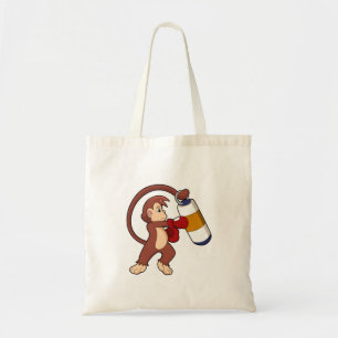 Singe à la boxe avec sac de poinçonnage