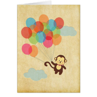 Singe adorable volant loin avec des ballons