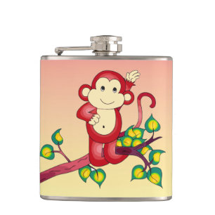 Singe rouge mignon avec flacon orange et jaune