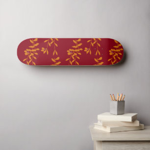 Skateboard Feuilles de branches de silhouette orange sur roug
