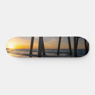 Skateboard Golden Sunrise Under Pensacola Pier Ski