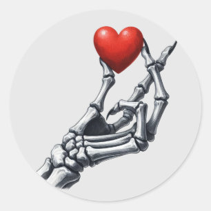 Skeleton Hand Lifting Red Heart Classic Round Sticker