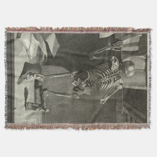 Skeleton reading throw blanket
