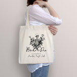 Skeleton Roses Bride or Die Bachelorette Party Tote Bag<br><div class="desc">Set the tone for your unique celebration with our Skeleton Roses Bride or Die Bachelorette Party Tote Bag. This gothic design features a skeleton with elegant floral accents, perfect for ladies who embrace a darkly romantic aesthetic. Invite your closest friends to join in the celebration of love and friendship with...</div>