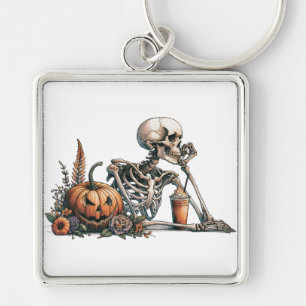 Skeleton with pumpkin and drink. Halloween Keychain