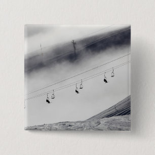 Skiers on a chair lift 2 inch square button